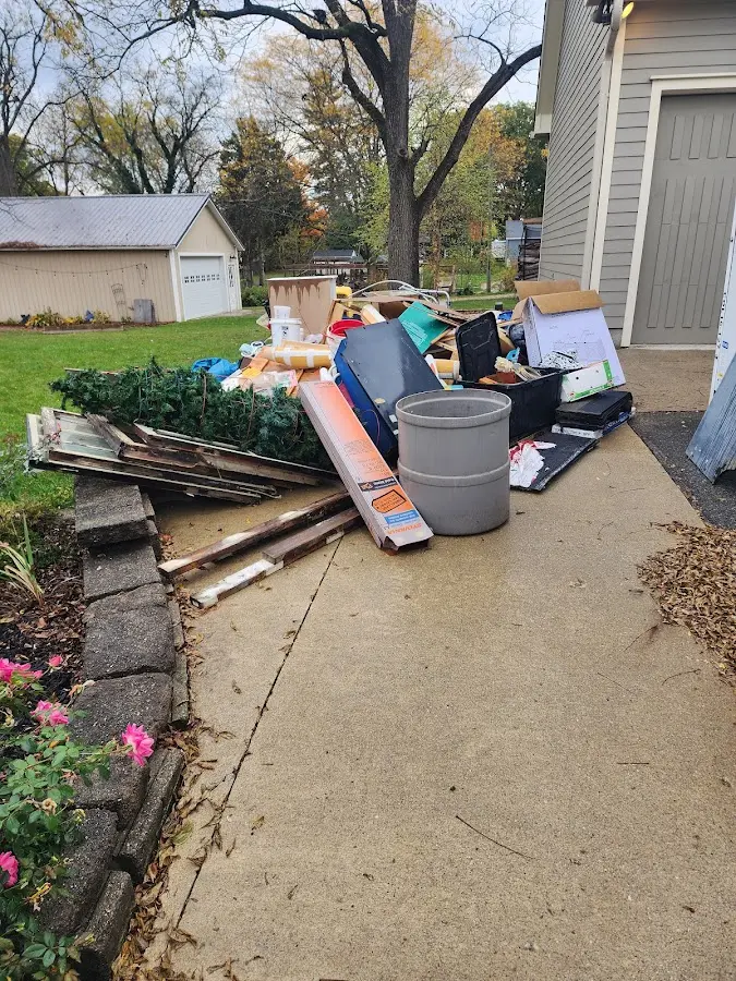 Dumpster being loaded with debris for 30 Yard Dumpster Rental in Martic